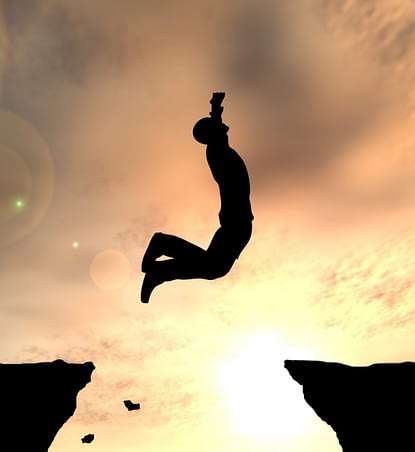 Concept or conceptual young man or businessman silhouette jump h